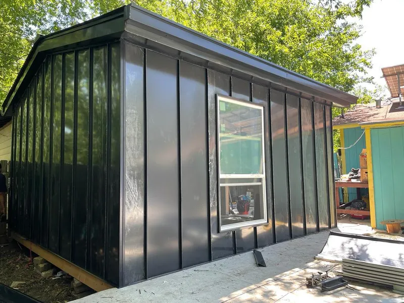 Black standing seam metal wall panels for Roof Inspection in Central City